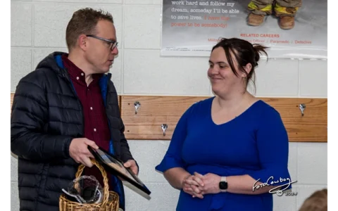 Aaron giving gifts to CH Kathrine Cota