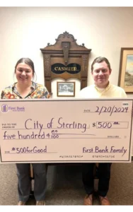 Brianna Gillespie, First Bank, poses with Sterling City Manager, Ian Hutcheson