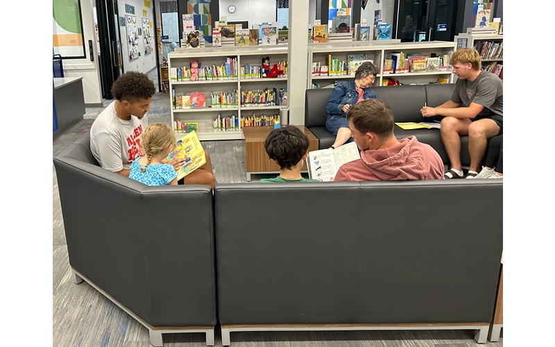 ACC Baseball Team Volunteers to Read with Children