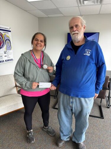 Cassandra Slife Receives Button Hunt Check