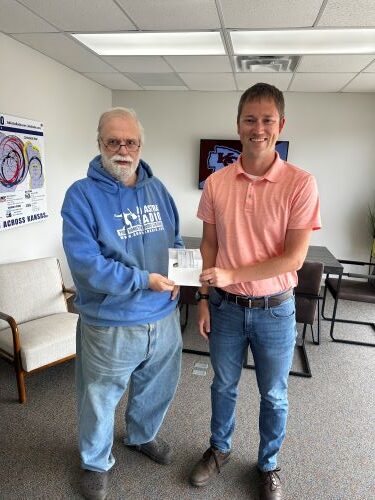 Nikolous Rempe Receives Button Hunt Check